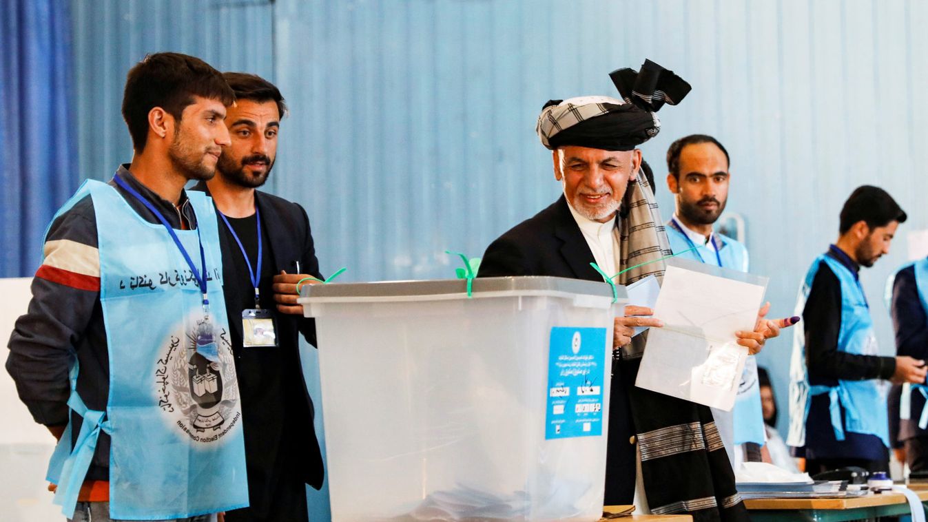 Afghan presidential candidate Ashraf Ghani arrives to cast his vote in the presidential election in Kabul, Afghanistan