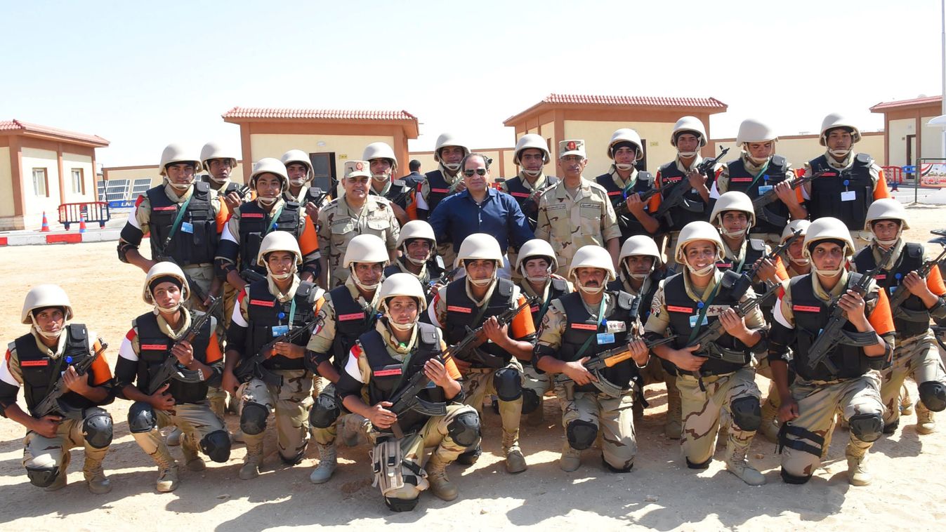 Egyptian President Abdel Fattah al-Sisi poses for a picture with army soldiers during a tour in the new Ismailia city
