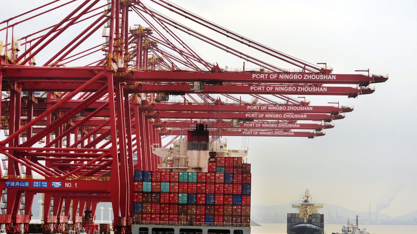 A ship loaded with container boxes is seen at a port in Ningbo