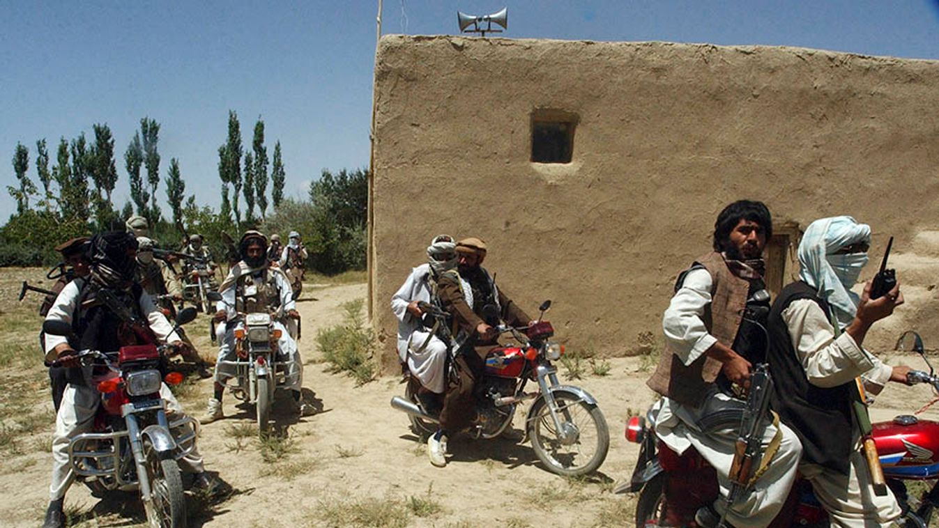 Taliban fighters ride on motorbikes in an undisclosed location in Afghanistan