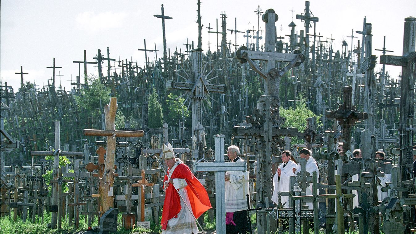 File photo of Pope John Paul II walking past a hill of crosses during his trip to Siauliai in ...