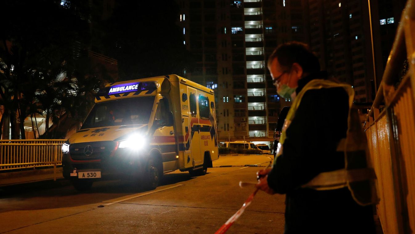 Ambulance leaves a public housing building, evacuating residents, following the outbreak of the novel coronavirus, in Hong Kong