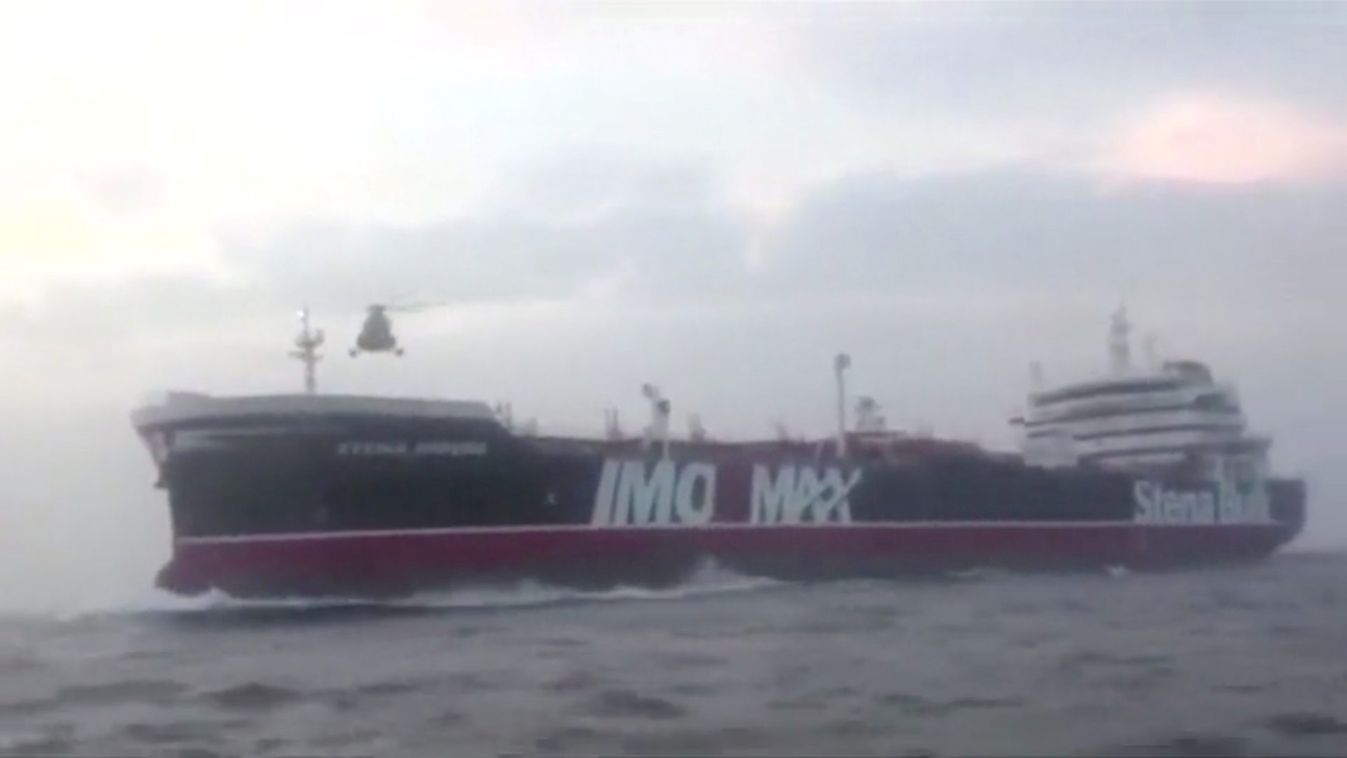 A helicopter hovers over British-flagged tanker Stena Impero near the strait of Hormuz