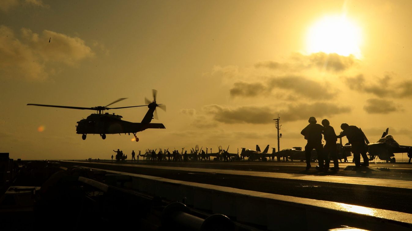 An MH-60S Sea Hawk helicopter lifts off the flight deck of the U.S. Navy aircraft carrier USS Abraham Lincoln, in Arabian Sea