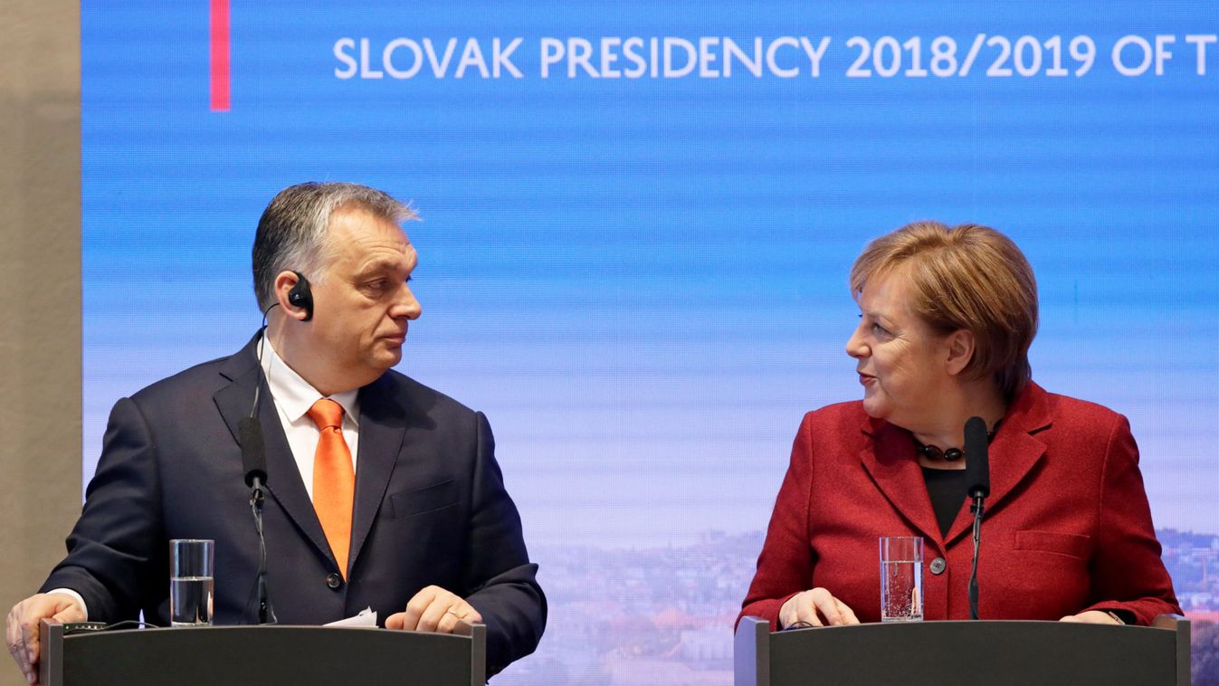 German Chancellor Angela Merkel speaks to Hungarian Prime Minister Viktor Orban during a news conference after the summit of the Prime Ministers of the Visegrad Group and Germany in Bratislava