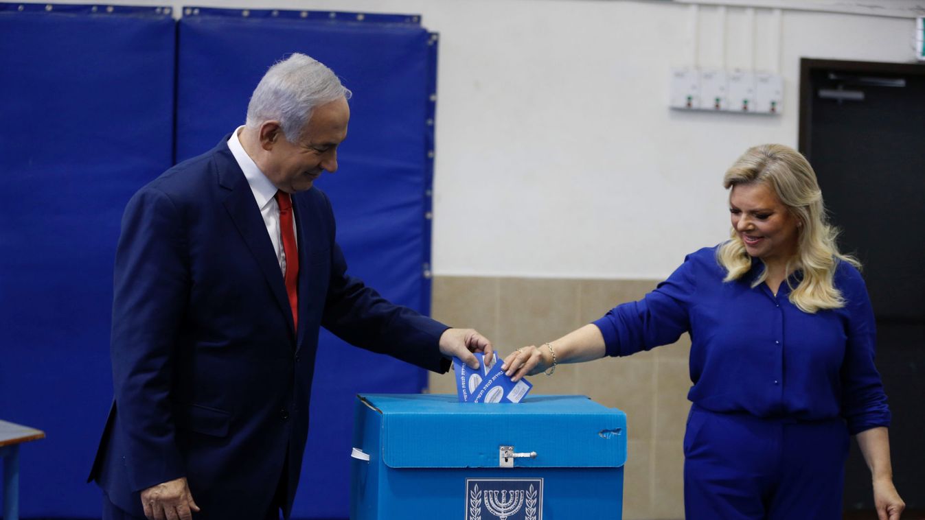 Israel’s Prime Minister Benjamin Netanyahu casts his vote with his wife Sara during Israel's parliamentary election in Jerusalem