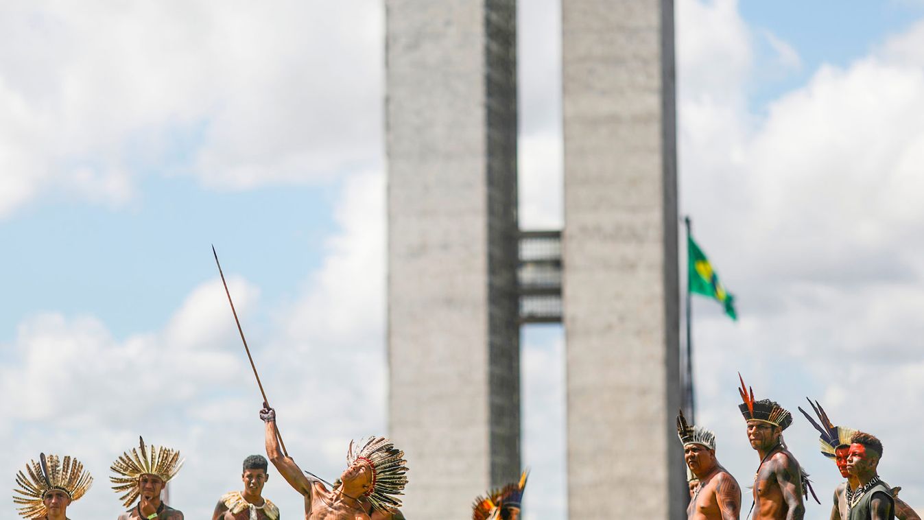 Indigenous men are pictured in front of National Congress during a protest to defend indigenous land and cultural rights that they say are threatened by the right-wing government of Brazil's President Jair Bolsonaro, in Brasilia