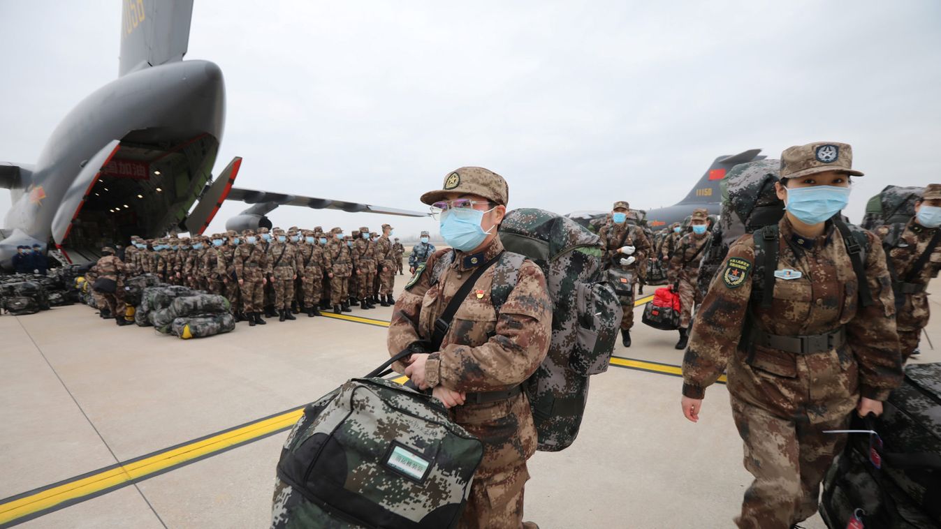 Medical personnel arrive with medical supplies in transport aircraft of the Chinese People's Liberation Army (PLA) Air Force at the Wuhan Tianhe International Airport