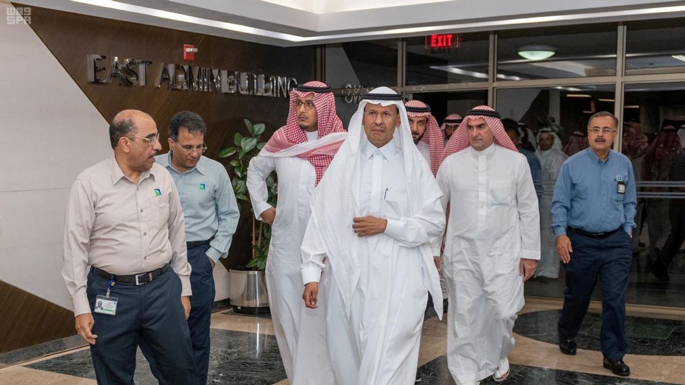 Saudi Energy minister Prince Abdulaziz bin Salman, walks during his visit to an Aramco oil facility one day after the attacks in Abqaiq