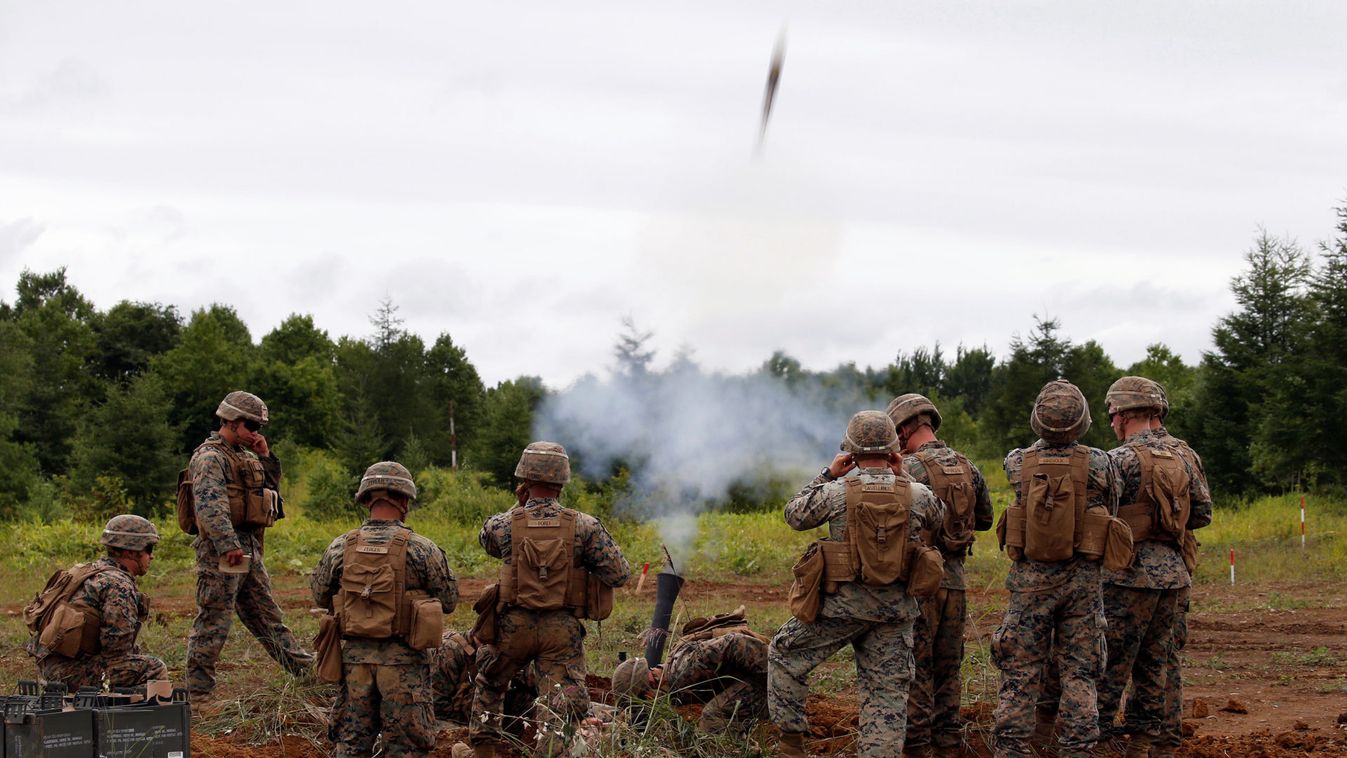 US Marines launch a mortar during a joint exercise with Japan's Ground Self Defense Force in Eniwa