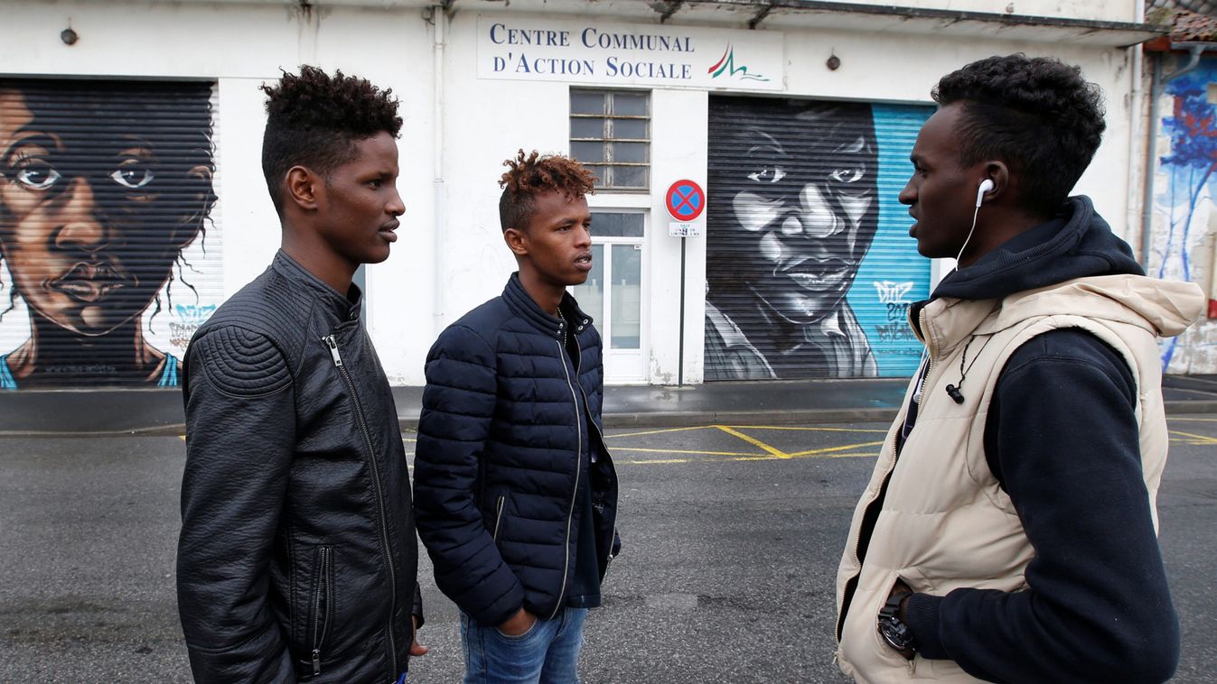 Mokhtar, a Sudanese migrant, speaks with friends at a refugee center after their arrival from Spain, in Bayonne