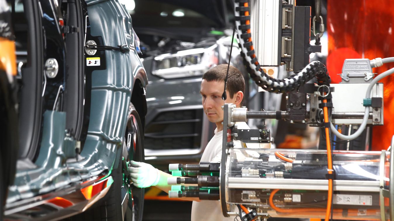 Worker assembles a new Audi at the production line of the German car manufacturer's plant in Ingolstadt