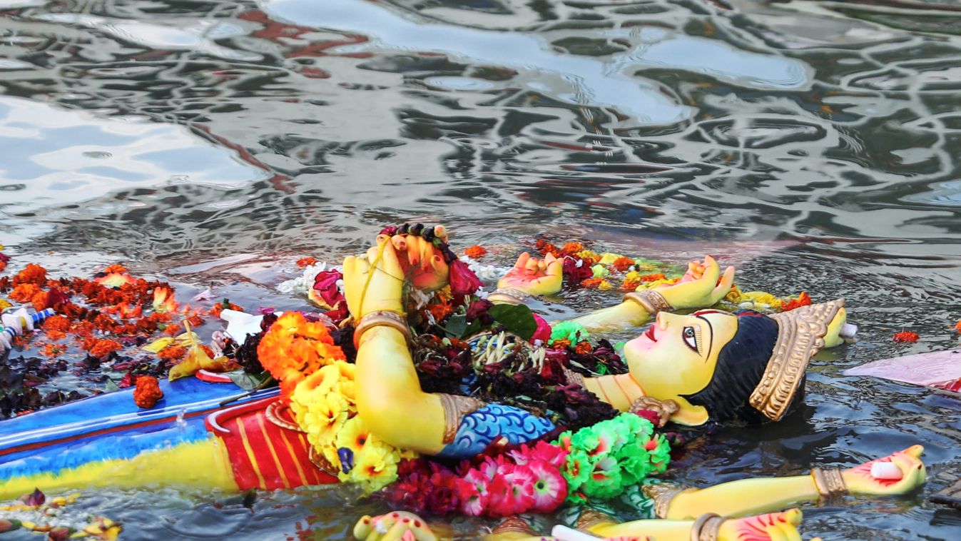 Idol of the Hindu goddess Durga is floating on the water after immersion into the Buriganga river on the last day of the Durga Puja festival in Dhaka