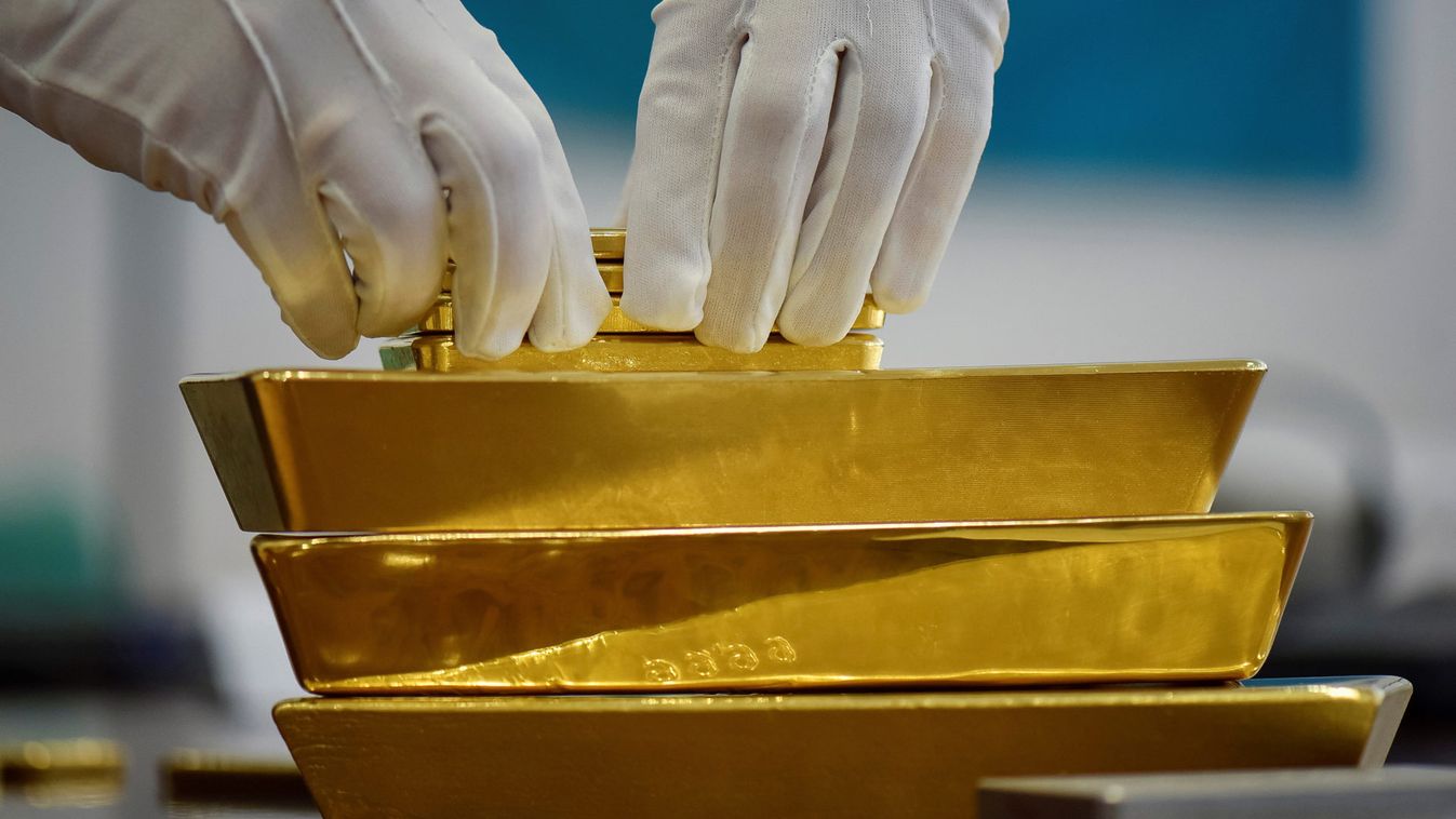 An employee places gold bars in the Kazakhstan's National Bank vault in Almaty
