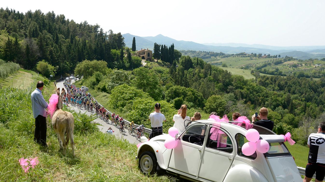 The pack of riders competes during the sixth stage of the 98th Giro d'Italia cycling race