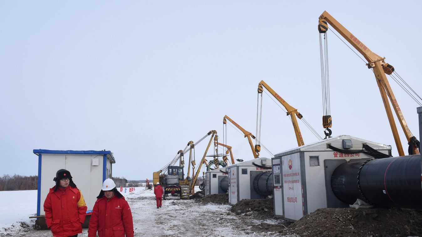 Workers of China National Petroleum Corporation (CNPC) are seen at a construction site of natural gas pipelines connecting China and Russia, in Heihe