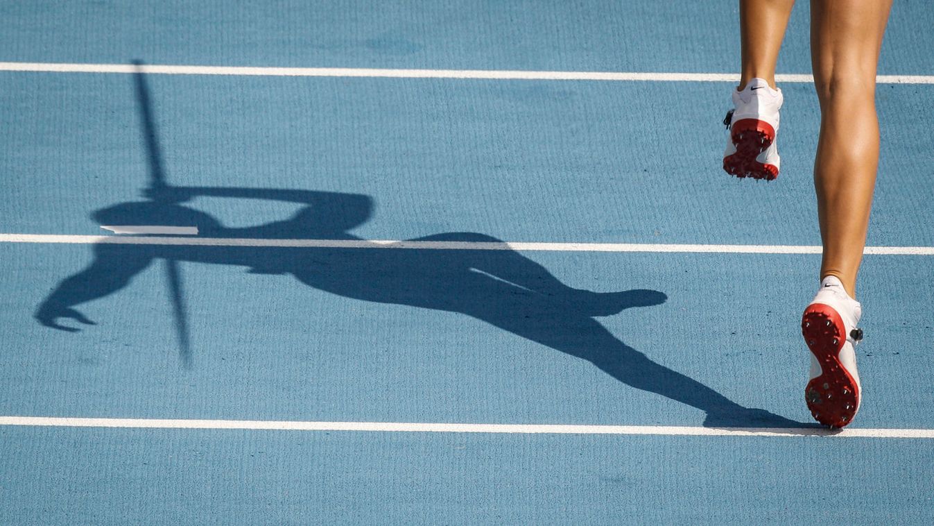 The shadow of Rachel Yurkovich of the U.S. is cast during the women's javelin throw qualifying event at the IAAF World Championships in Daegu