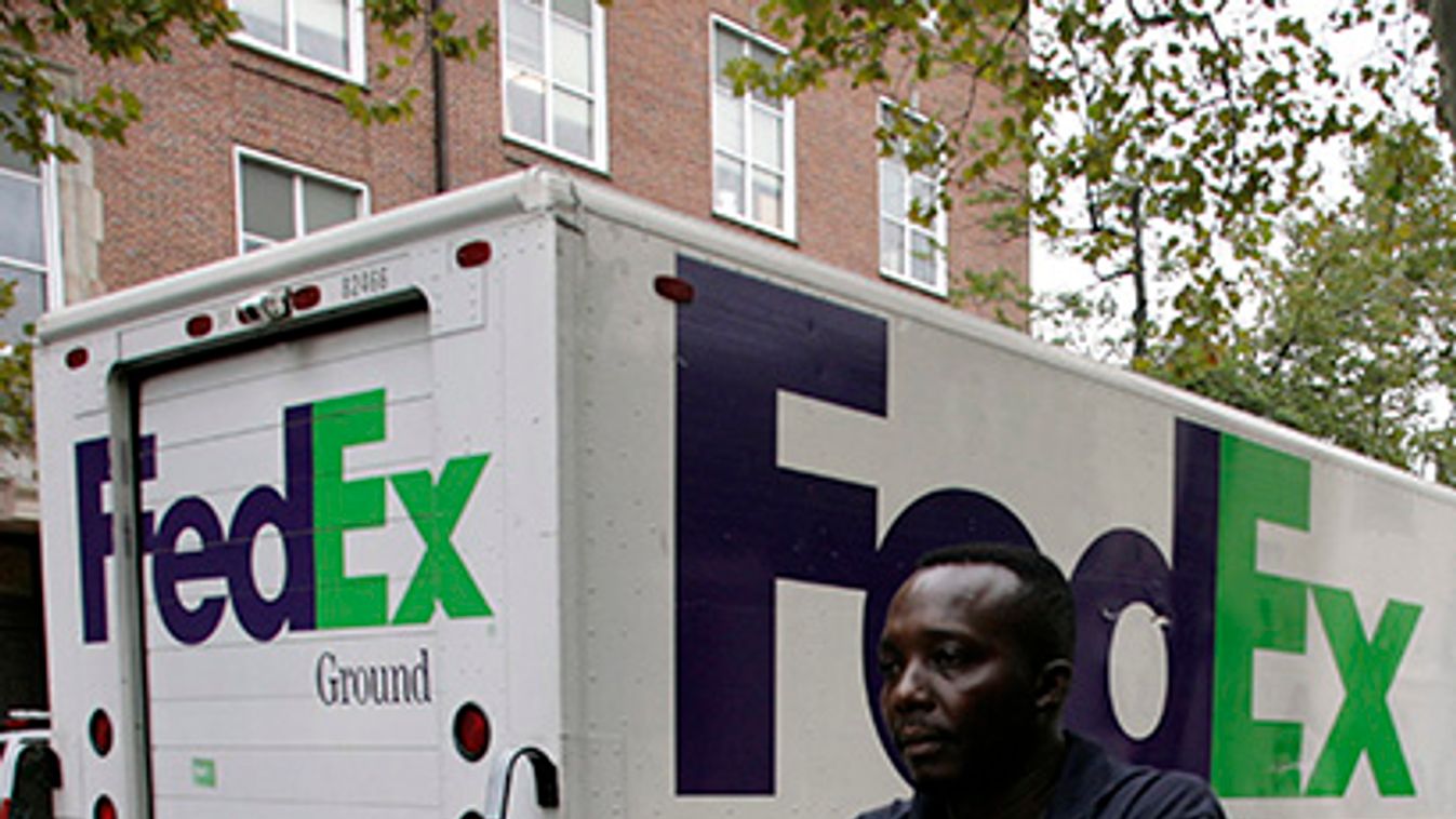 A FedEx driver delivers packages in Washington