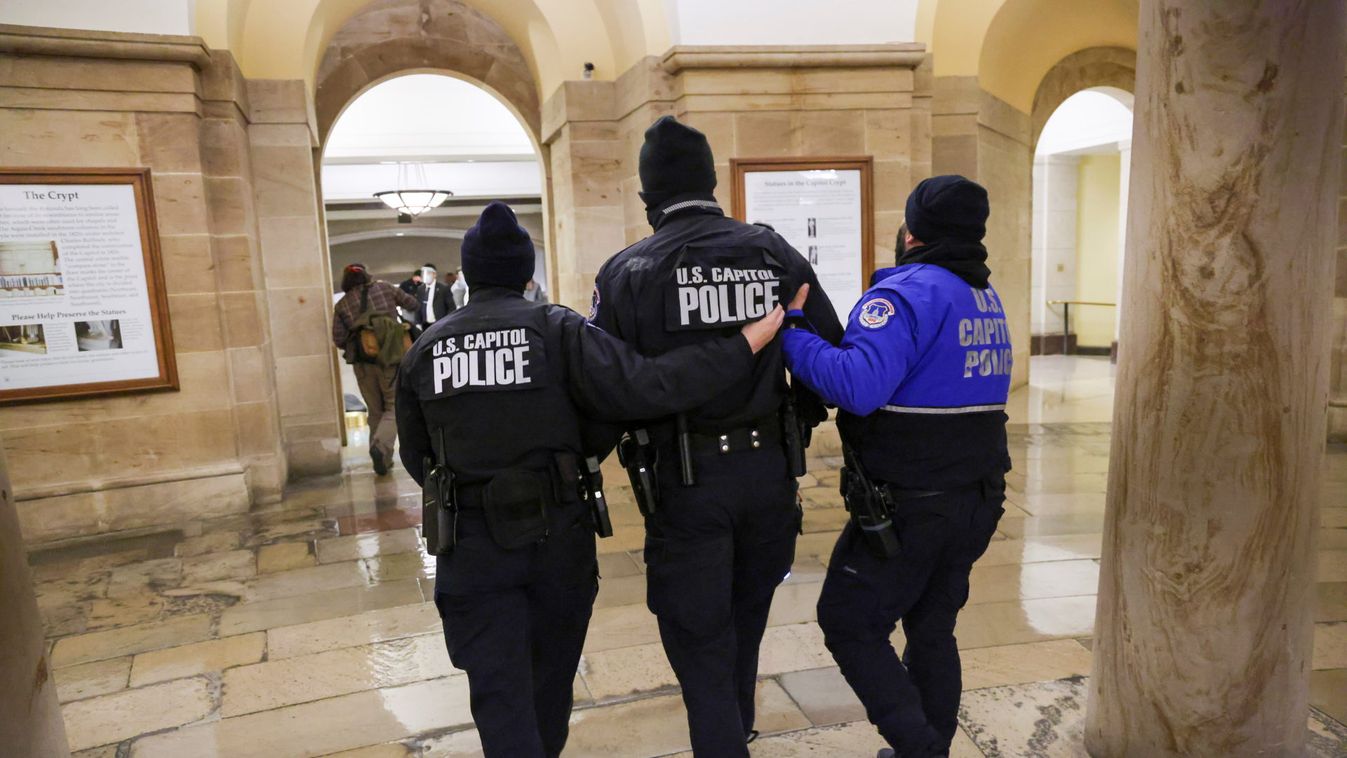 Members of the U.S. Capitol Police walk inside the Capitol as supporters of U.S. President Donald Trump protest outside, in Washington