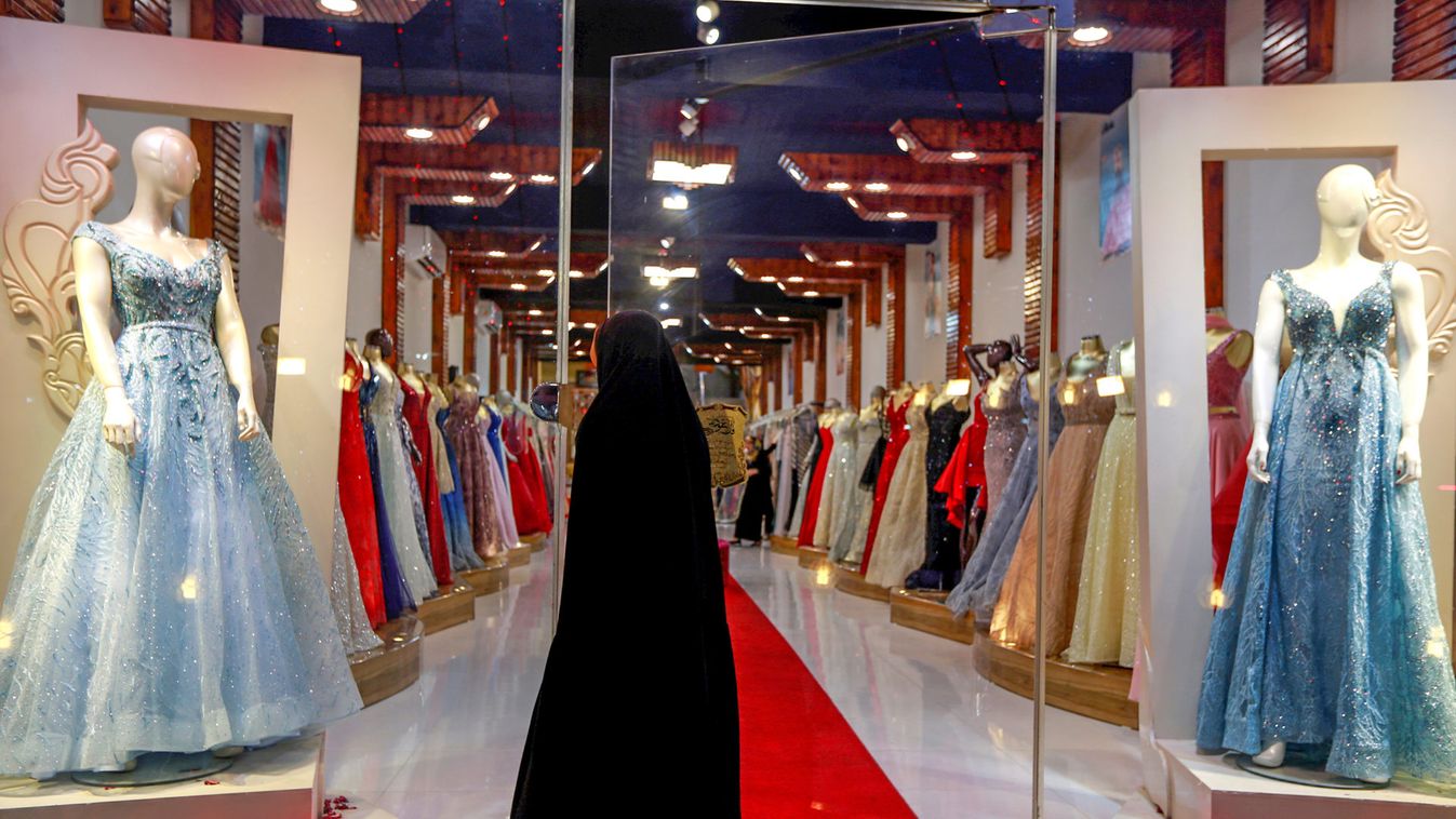 An Iraqi woman enters a wedding dresses shop in the holy Shi'ite city of Najaf