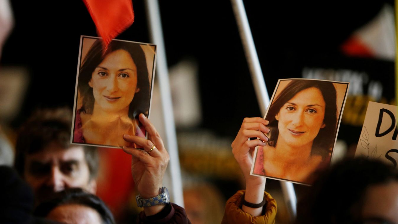 People carry photos of assassinated anti-corruption journalist Daphne Caruana Galizia during an anti-corruption protest against the government of Prime Minister Joseph Muscat, in Valletta