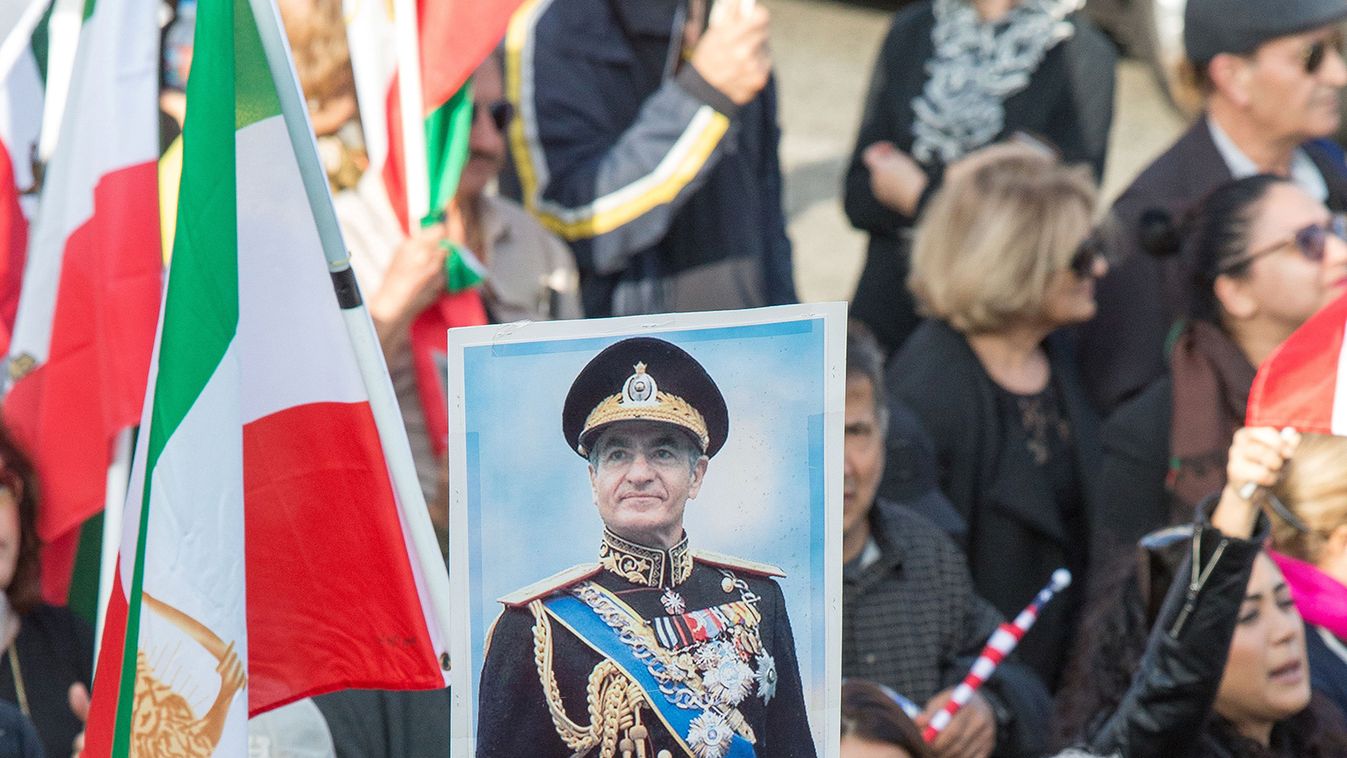 A placard with an image of Iran's deposed shah Mohammed Reza Pahlavi is seen as thousands of people rally in support of Iranian anti-government protests in Los Angeles