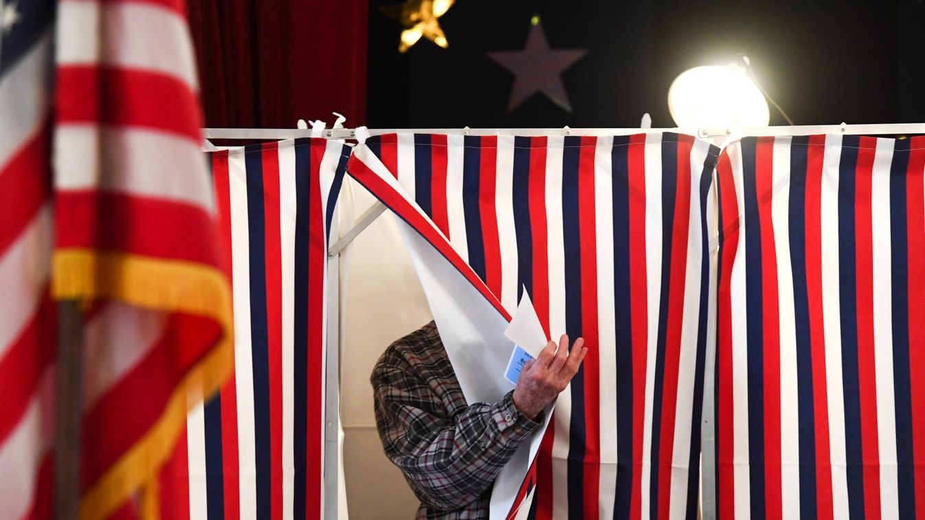 Voter leaves a voting booth after casting his ballot in the state's presidential primary election in Greenfield