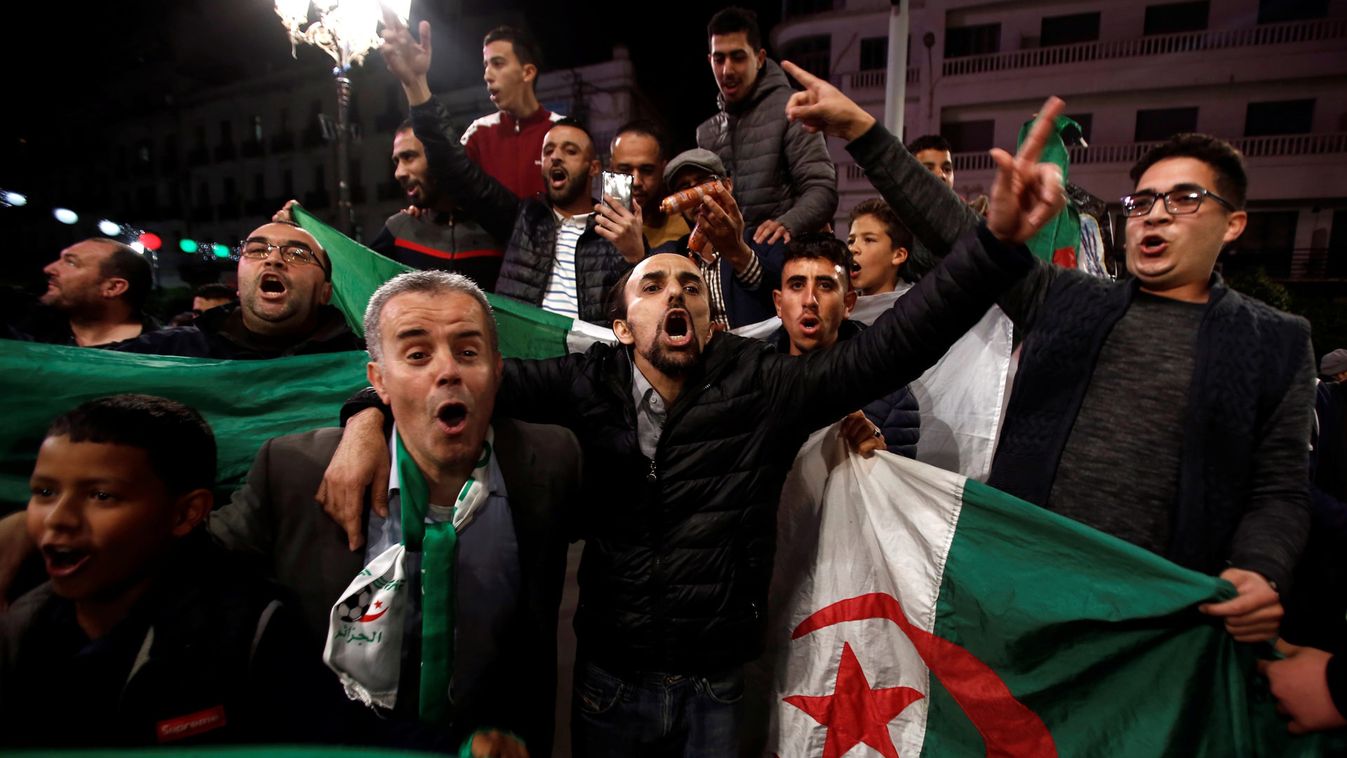 People celebrate on the streets after Algeria's President Abdelaziz Bouteflika has submitted his resignation, in Algiers