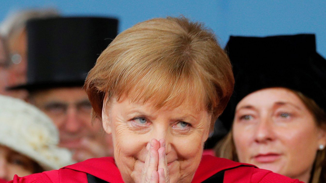 German Chancellor Angela Merkel acknowledges the applause as she receives an honorary degree during Commencement Exercises at Harvard University in Cambridge