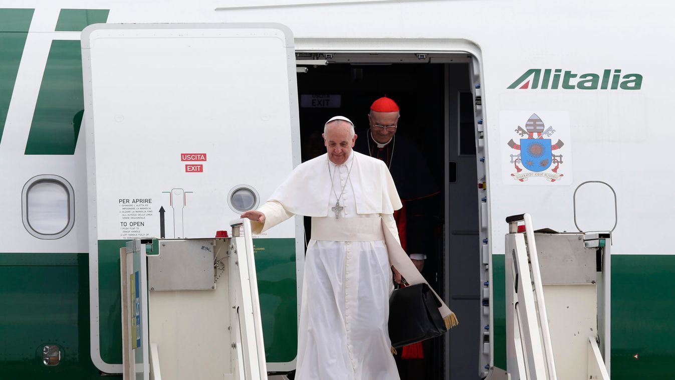 Pope Francis (L) and Cardinal Tarcisio Bertone step off a plane after their trip to Brazil at Ciampino airport