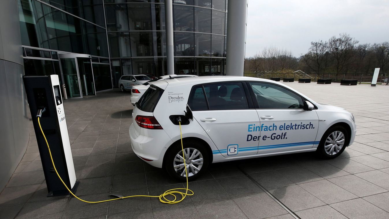 VW e-Golf electric car charges outside the Transparent Factory in Dresden