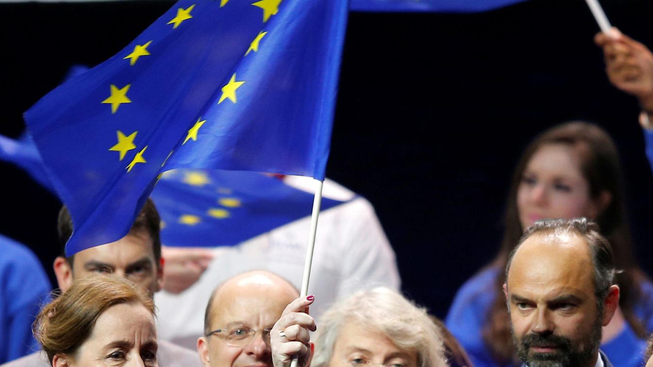 Nathalie Loiseau, head of the Renaissance (Renewal) list for the European elections, holds a European flag at the end of a political rally with French Prime Minister Edouard Philippe, in Strasbourg
