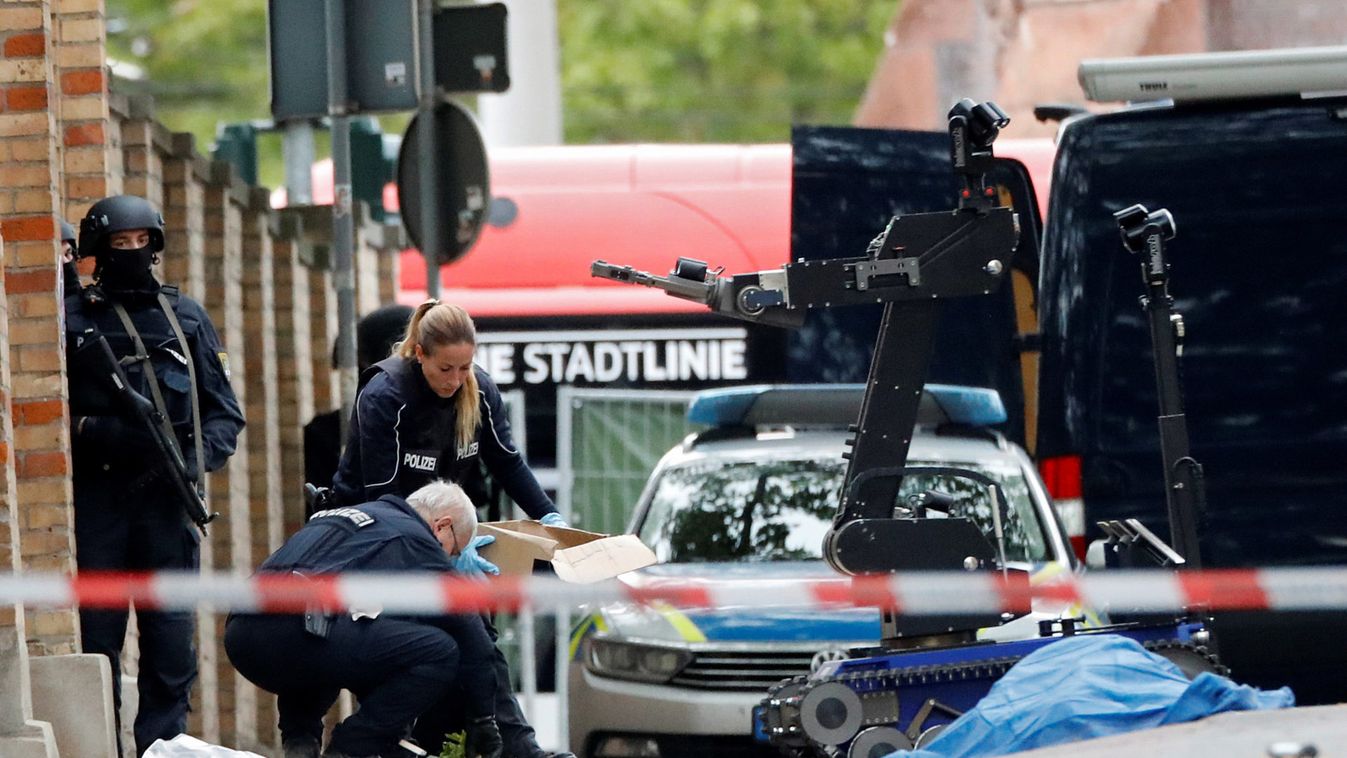 Police officers work at the site of a shooting in Halle
