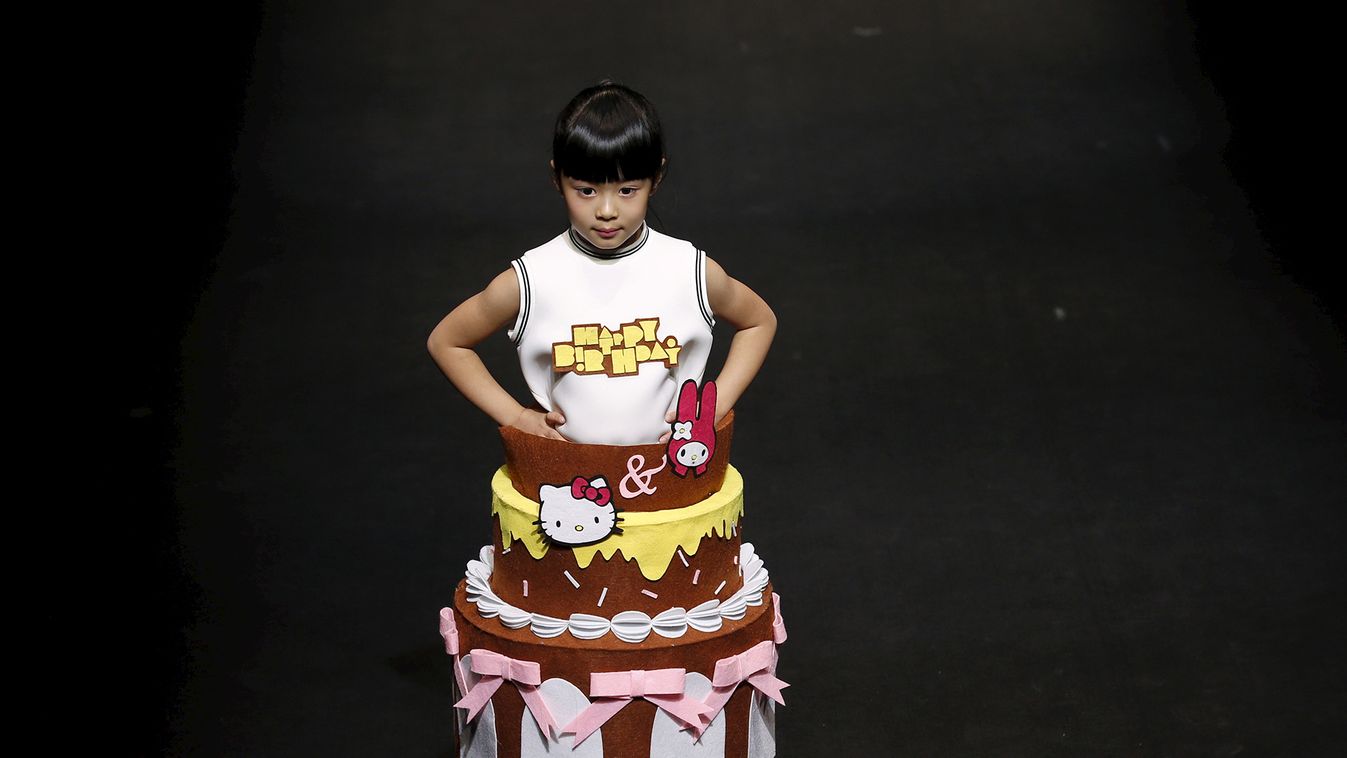 Child model presents a creation from Hello Kitty&My Melody Comme Tu Es Parent-child Outfit Collection during China Fashion Week S/S 2016 in Beijing