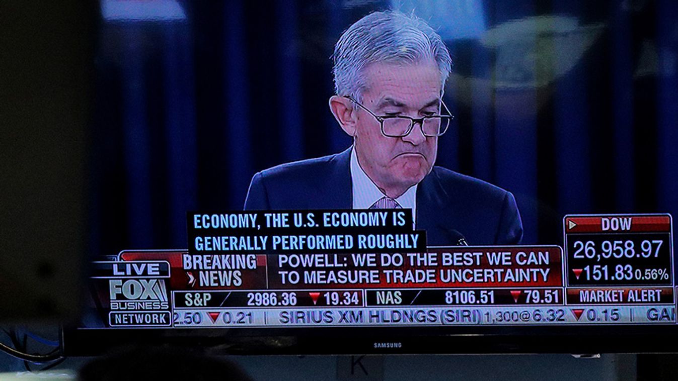 A trader works as a screen shows Federal Reserve Chairman Jerome Powell's news conference after the U.S. Federal Reserve interest rates announcement on the floor of the  NYSE in New York