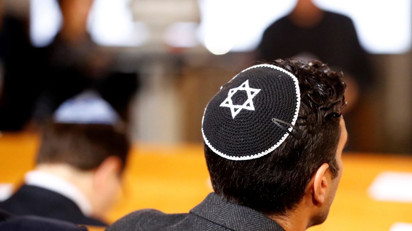 A man wearing a kippah is seen before a ceremony to mark the 80th anniversary of Kristallnacht, also known as the Night of Broken Glass, at Rykestrasse Synagogue, in Berlin