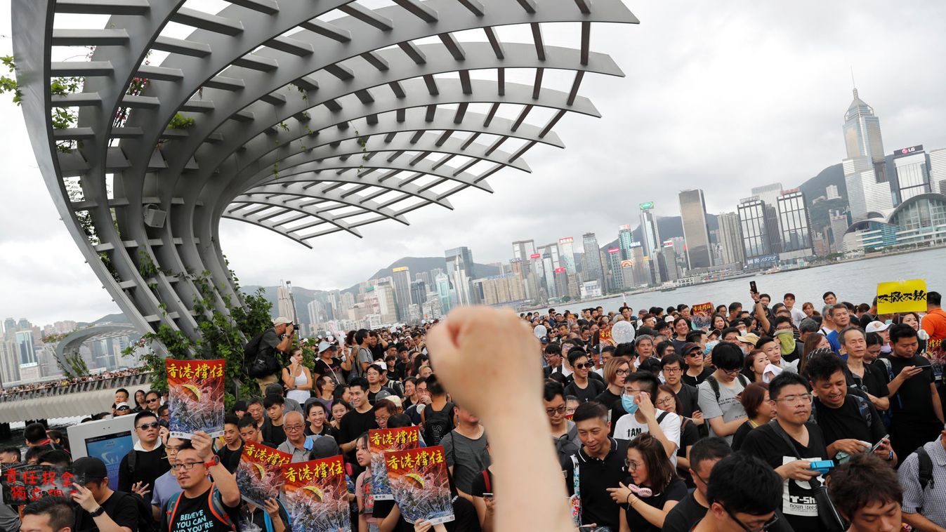 Anti-extradition bill protesters march to West Kowloon Express Rail Link Station at Hong Kong's tourism district Tsim Sha Tsui