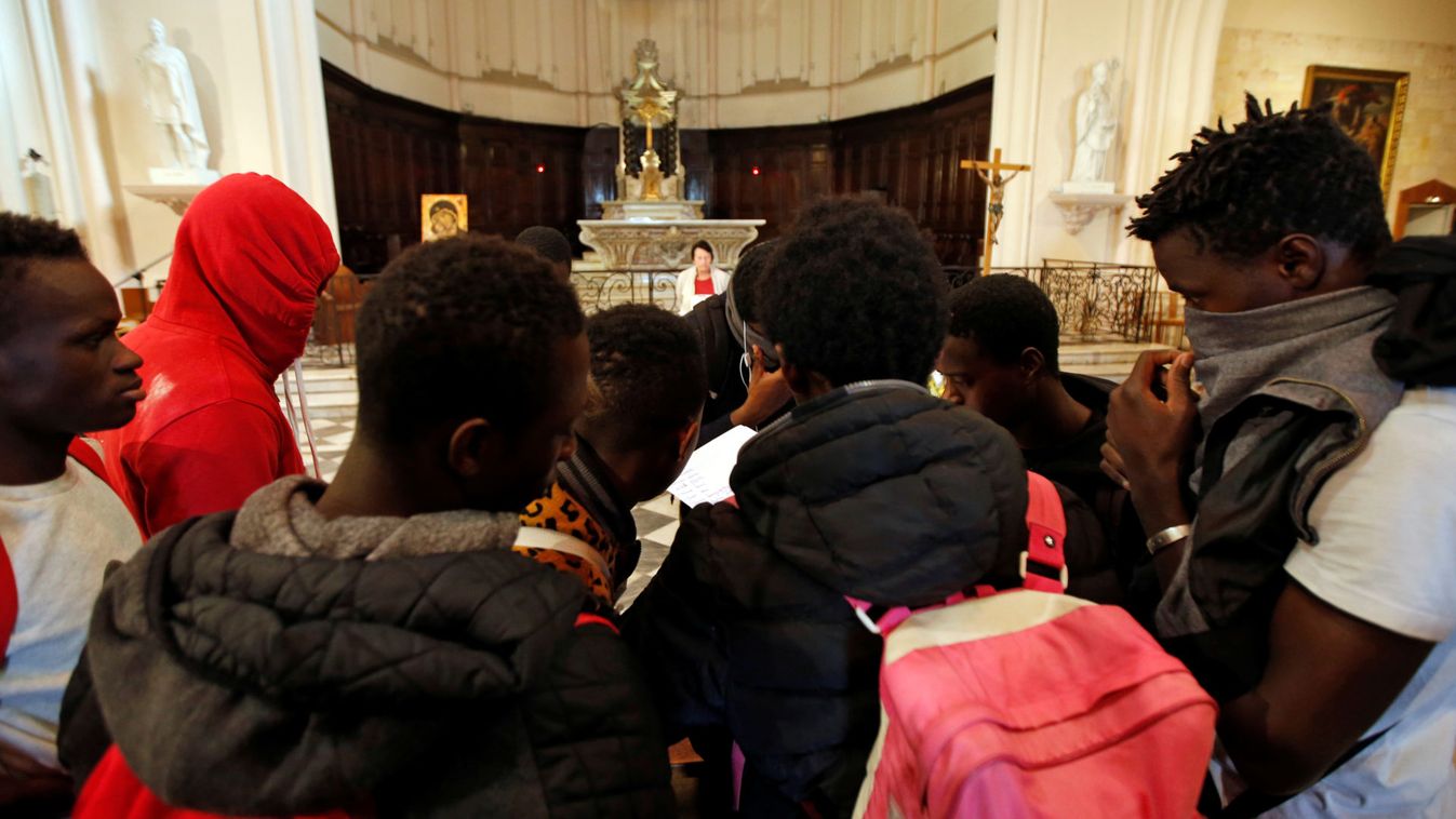 Migrants gather as they occupy the Saint Ferreol church to protest against the life conditions of unaccompanied minor migrants in Marseille