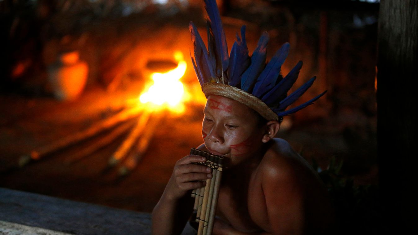 A member of the AmazonianTatuyo tribe look on in her village in the Rio Negro (Black River) near of Manaus city in Brazil