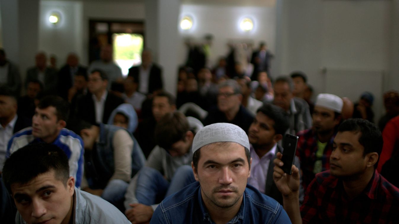 People attend prayers for the Muslim holiday of Eid Al-Adha at a mosque in Gdansk