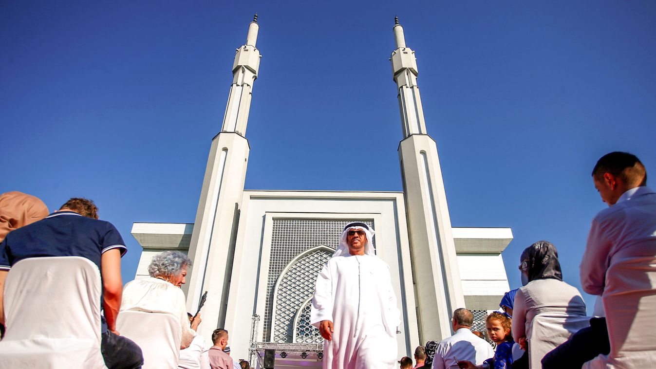 Guests sit in front of Istiqlal mosque during Sharia wedding ceremony for sixty couples in Sarajevo