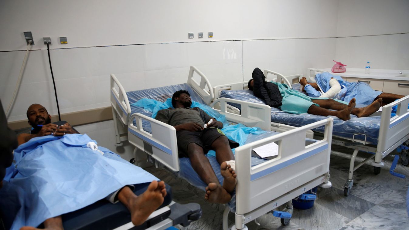 Wounded migrants lie on hospital beds after an air strike hit a detention center for mainly African migrants in Tajoura, in Tripoli Central Hospital