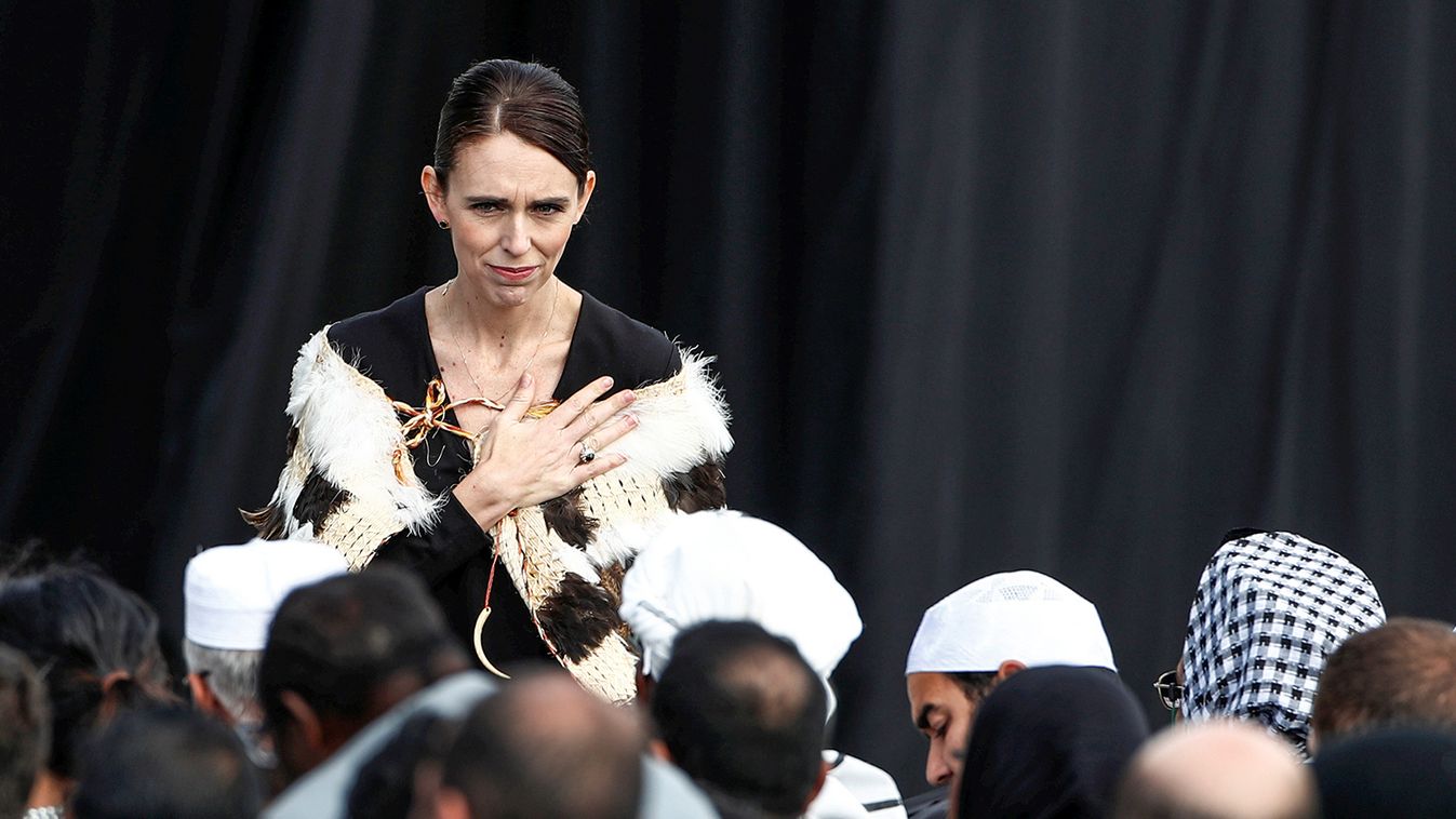 New Zealand's Prime Minister Jacinda Ardern gestures to relatives of victims of the mosque attacks during the national remembrance service, at Hagley Park in Christchurch