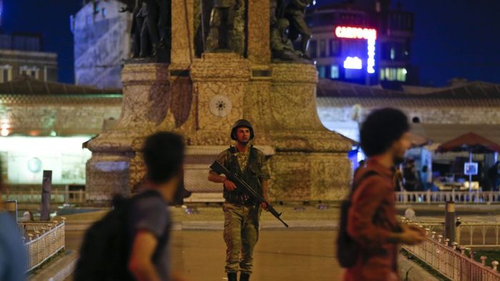 A Turkish military stands guard in the Taksim Square in Istanbul