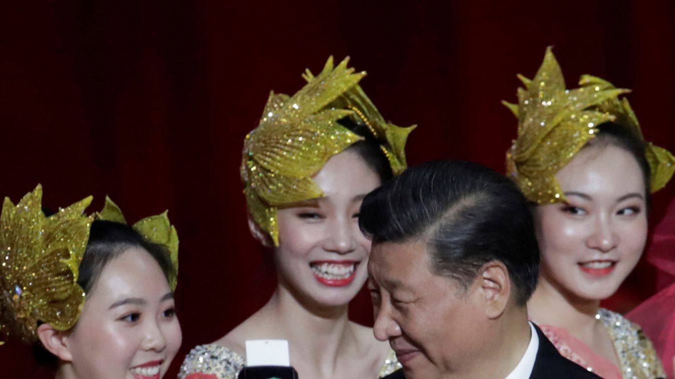 Chinese President Xi Jinping smiles at the performers on the stage during a cultural performance in Macau