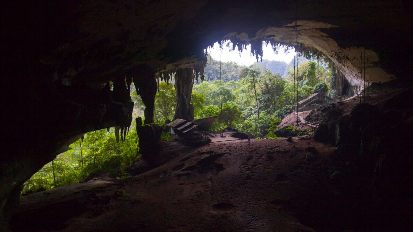 A tourist walks at the main entrance of the Niah Great Cave at Niah National Park, in the Malaysian state of Sarawak in Borneo island,