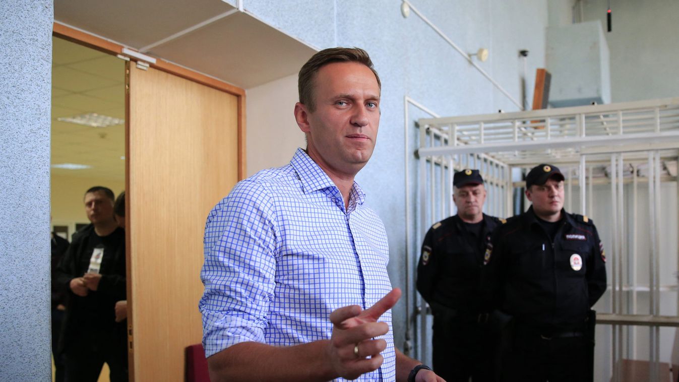 Russian opposition leader Navalny addresses journalists after a court hearing in Moscow