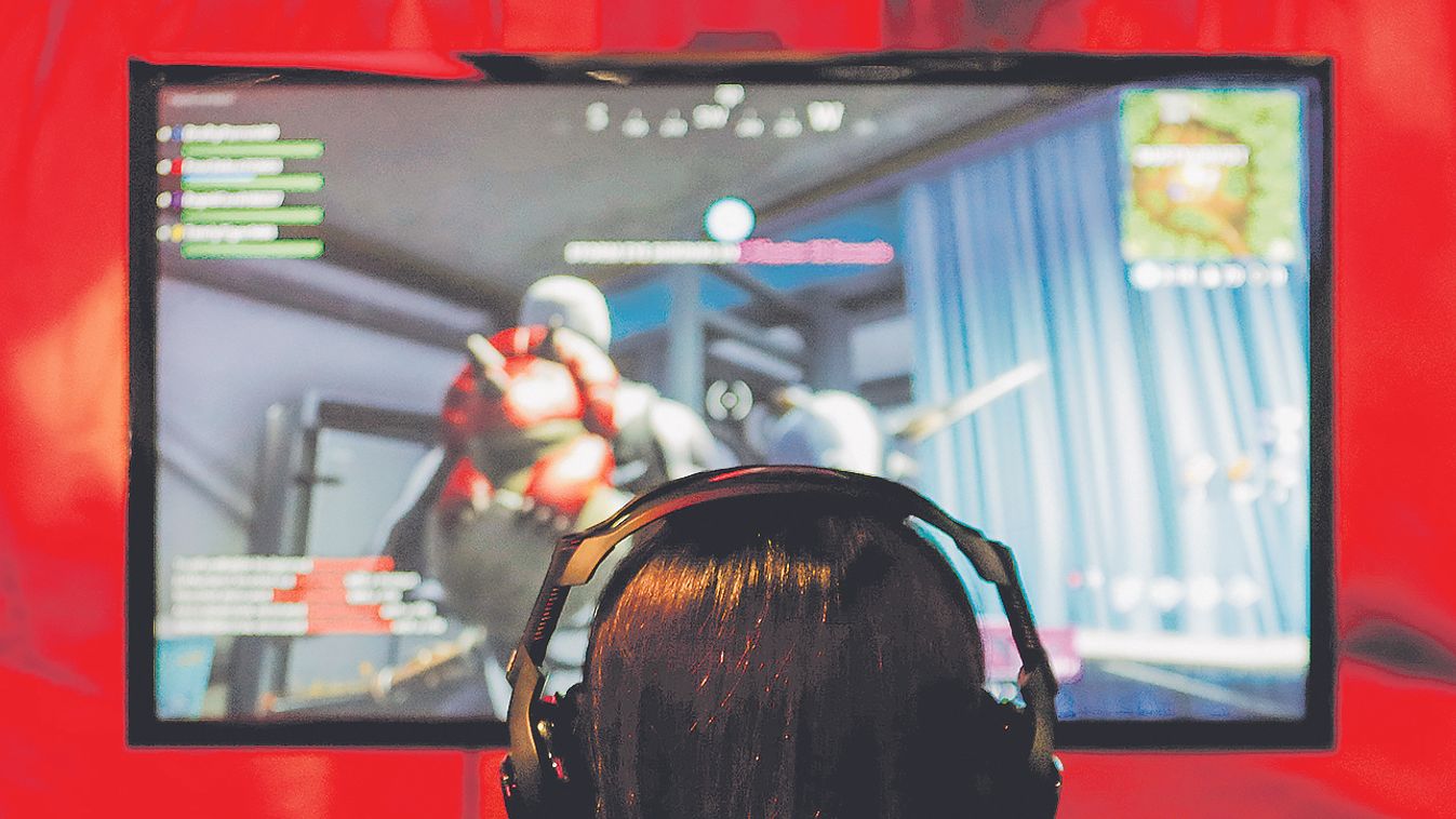 An attendee plays a video game at E3, the world's largest video game industry convention in Los Angeles