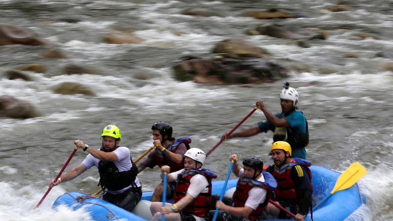 A group of the press and government representatives practice rafting guided by ex-FARC rebels in Miravalle