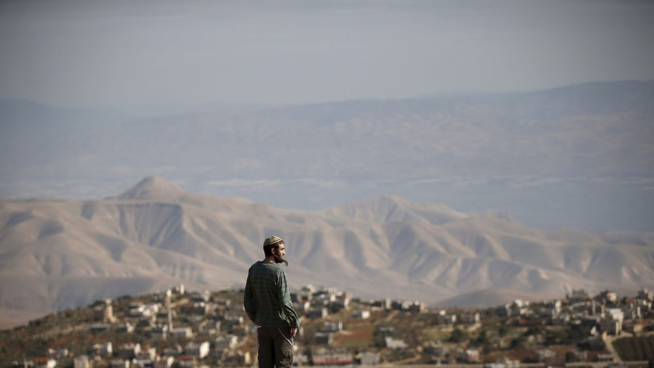 Jewish settler Morris stands at an observation point overlooking the West Bank village of Duma, near Yishuv Hadaat, an unauthorised Jewish settler outpost